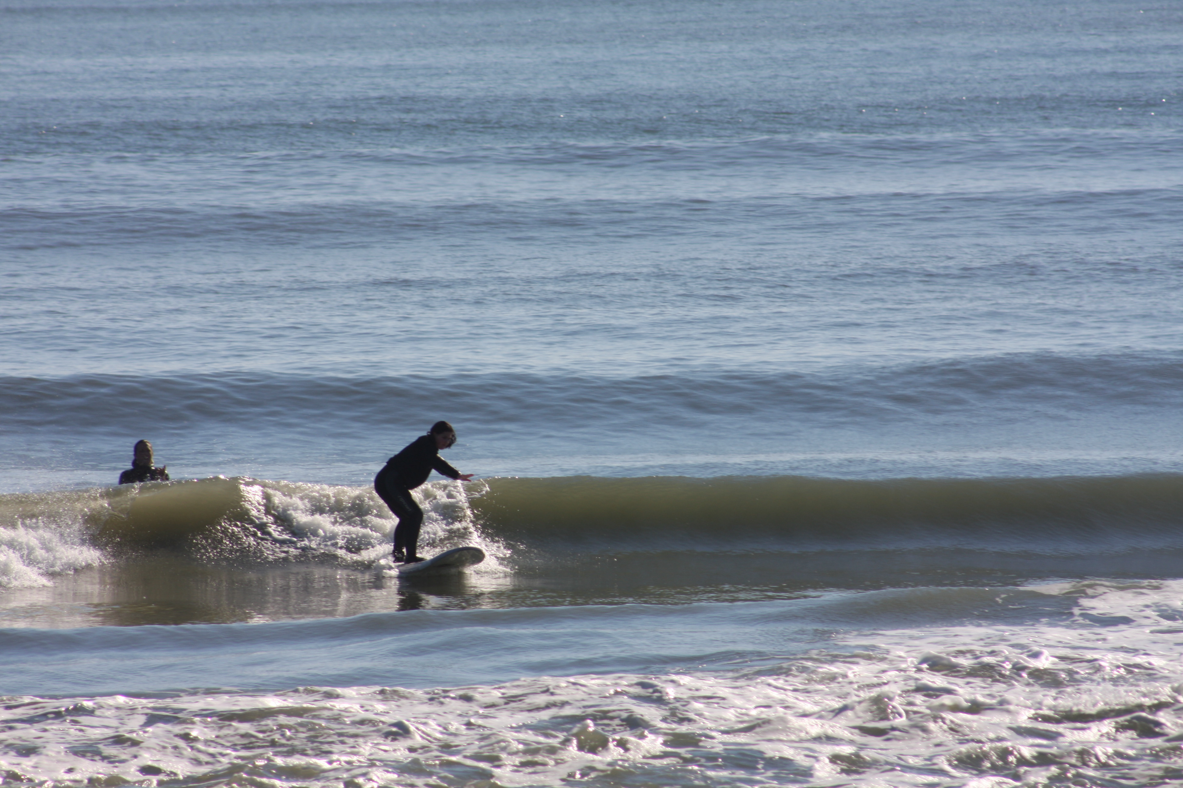 First time surfer getting some good waves during winter sessions First time surfer getting some good waves during winter sessions