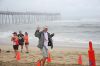 Tommy Hodge crosses the finish line of the 2016 Memorial Day Shore Break 5K Sponsored by Midgett Realty